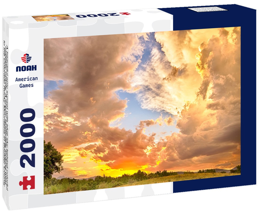 A beautiful epic sunset with blue sky behind colorful majestic clouds. A scenic landscape looking west to the Colorado Rocky Mountains in Boulder County where the sky meets the land 2000pc Puzzle