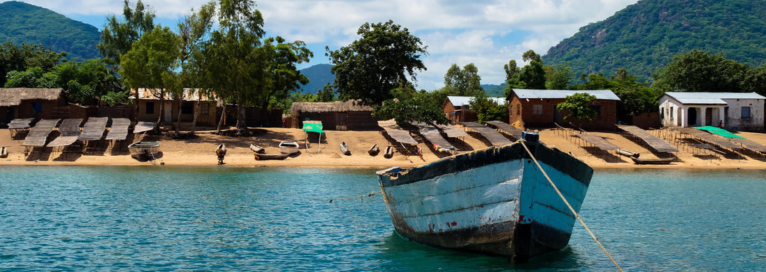 Noah Jigsaw Puzzle Boat in Lake Malawi with nice view of the coast and beach panorama 1000 pieces