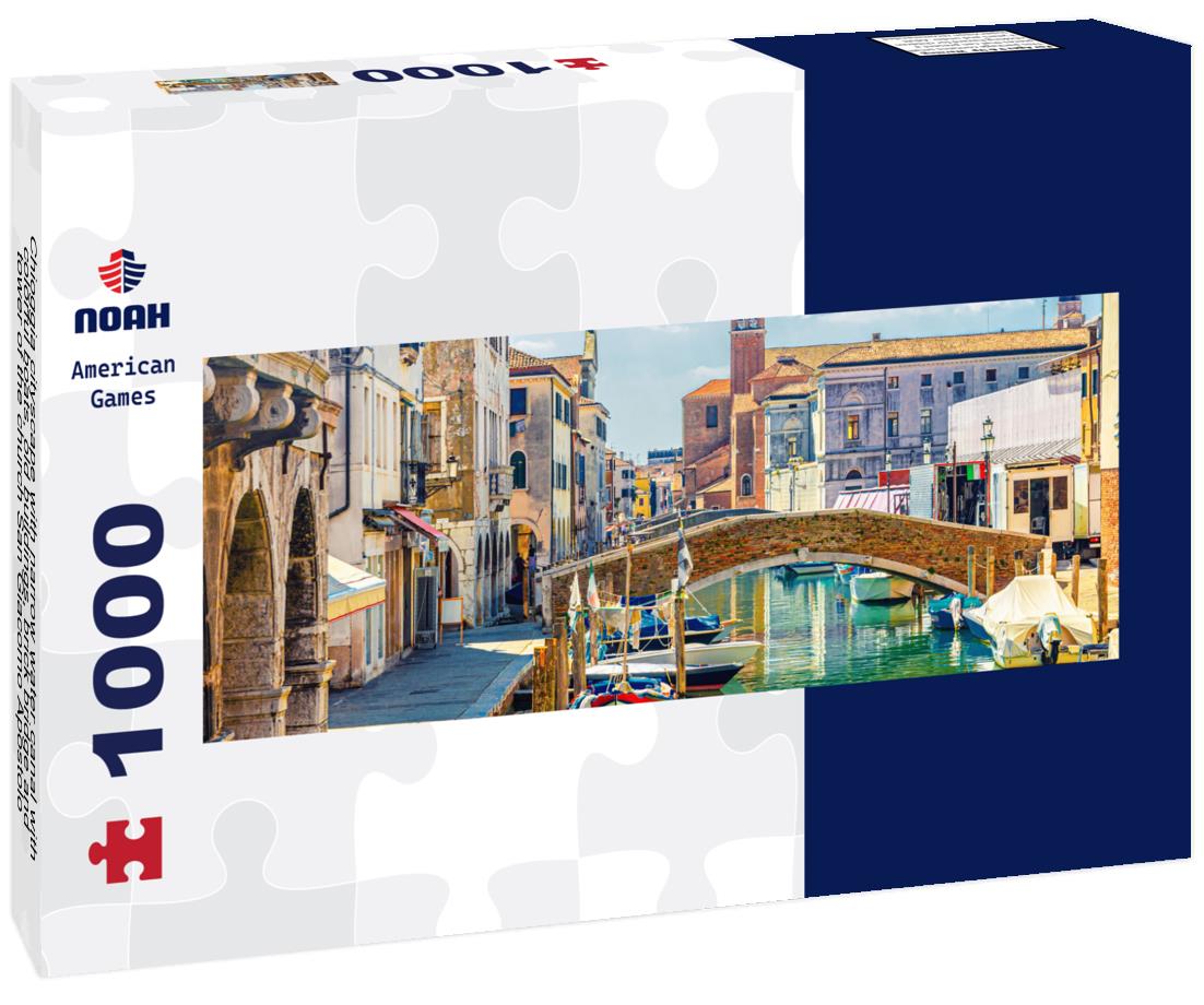 Noah Jigsaw Puzzle Chioggia cityscape with narrow water canal with colorful boats, old buildings, brick bridge and tower of the church San Giacomo Apostolo, blue sky in summer, Veneto region, northern Italy panorama 1000 pieces