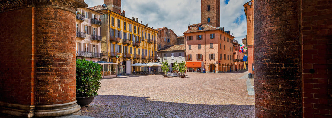 Noah Jigsaw Puzzle View of Kobelsteinplatz between old houses and medieval towers under the beautiful sky in Alba, Piedmont, northern Italy panorama 1000 pieces