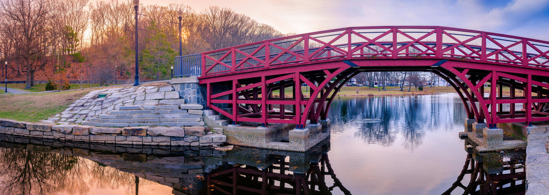 Noah Jigsaw Puzzle Arching Pink Wooden Bridge and Reflections over the Pond at Elm Park in Worcester, Massachusetts. Tranquil Sunset Landscape over the Mirror Like Lake Water. Asian Style Architecture in American Town panorama 1000 pieces