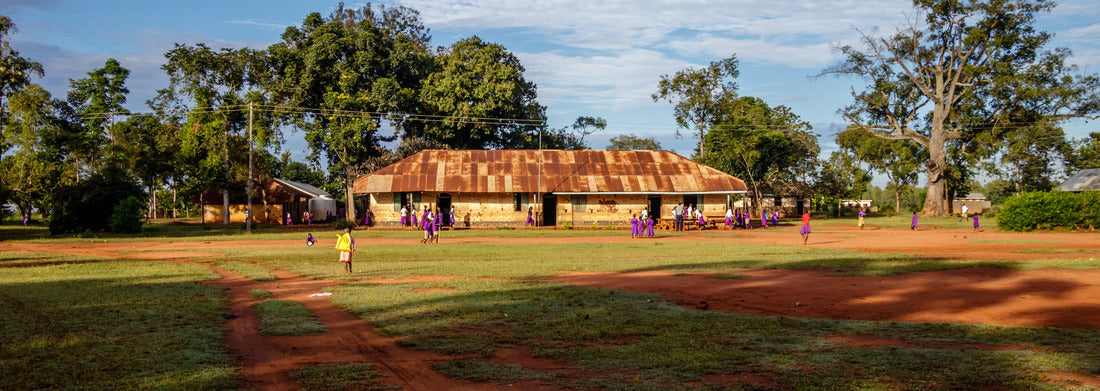 Noah Jigsaw Puzzle Kolonyi, Uganda: Many students with purple uniform waiting to enter the primary school in Kolonyi near Mbale in Uganda on a beautiful morning in November panorama 1000 pieces