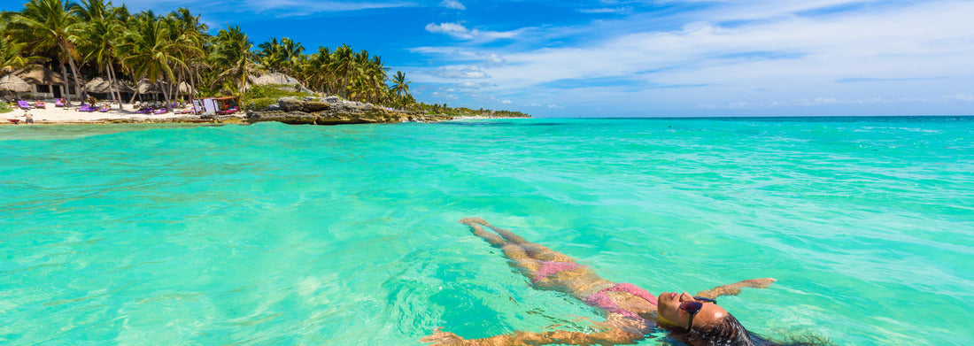Noah Jigsaw Puzzle Attractive young woman relaxing in the turquoise waters of the Caribbean Sea in front of Paradise Beach in Tulum, near Cancun, Riviera Maya, Mexico panorama 1000 pieces
