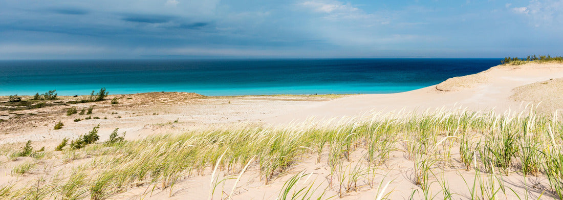 Noah Jigsaw Puzzle Azure blue skies and the waters of Lake Michigan are the backdrop to Sleeping Bear Dunes National Lakeshore in Glen Haven Michigan panorama 1000 pieces