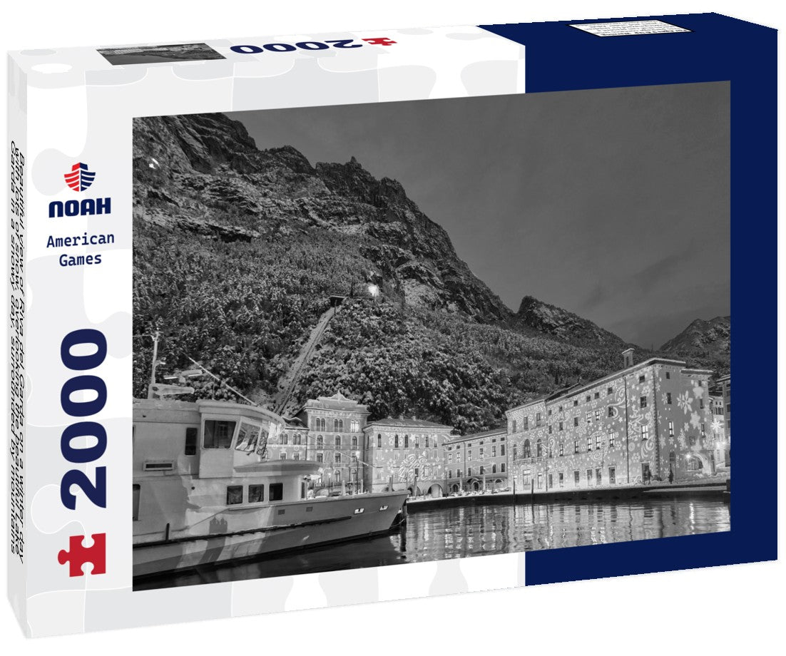 Noah Jigsaw Puzzle Beautiful view of Riva del Garda on a winter day with lots of snow, overlooking the beautiful Lake Garda in a snowy day, surrounded by mountains, Trentino Alto Adige region in black white 2000 pieces