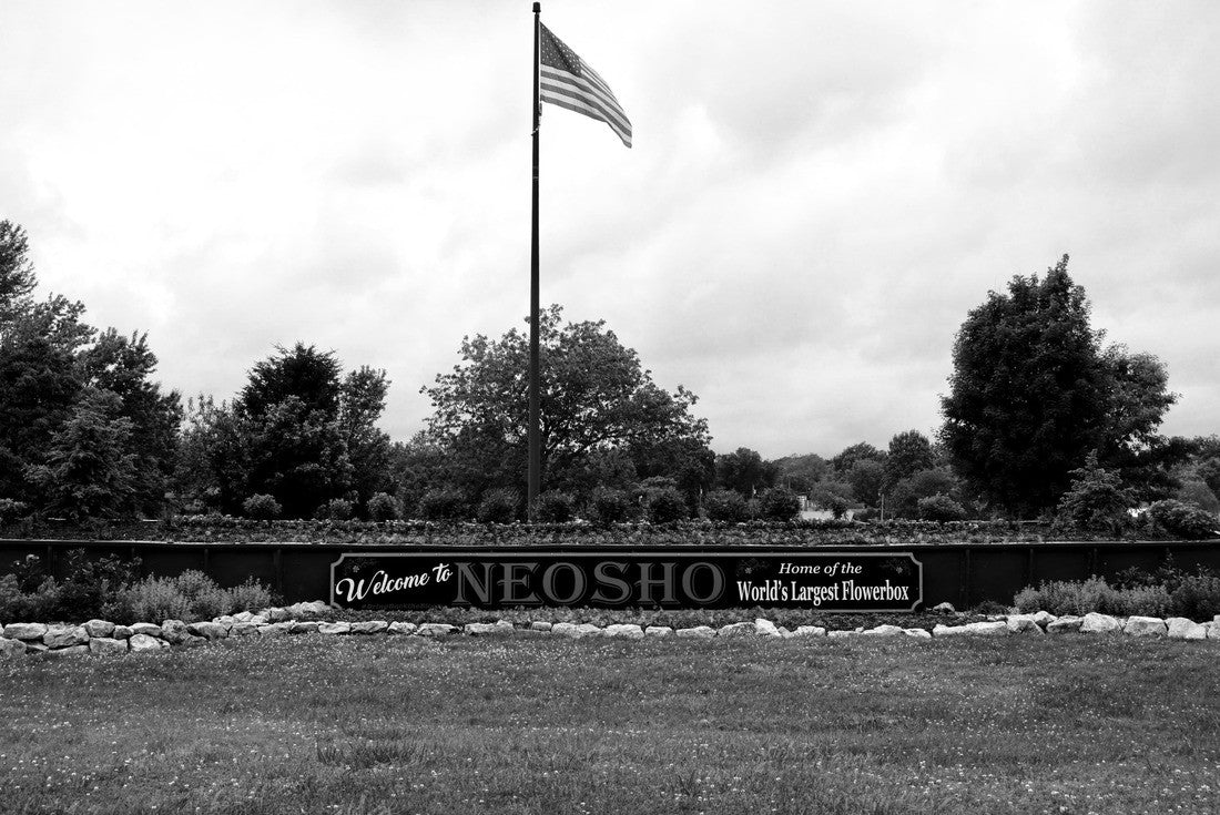 Neosho, Missouri: World's Largest Flower Box and American Flag. Flowerbox made from a 66-foot-long green railroad gondola car. The city is known as “The Flower Box City.” 2000pc PuzzleBlack and White