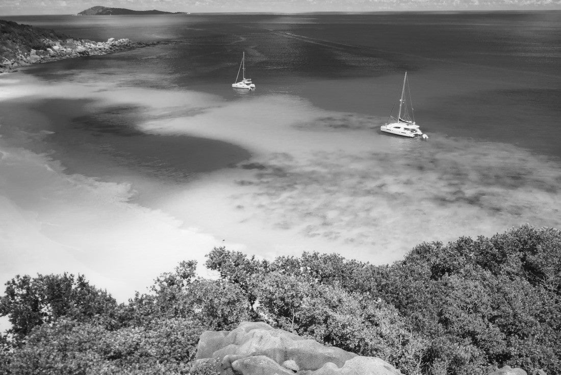 Aerial of Grand Anse beach at La Digue island in Seychelles. White sandy beach with blue ocean lagoon and catamaran yacht moored 2000pc PuzzleBlack and White