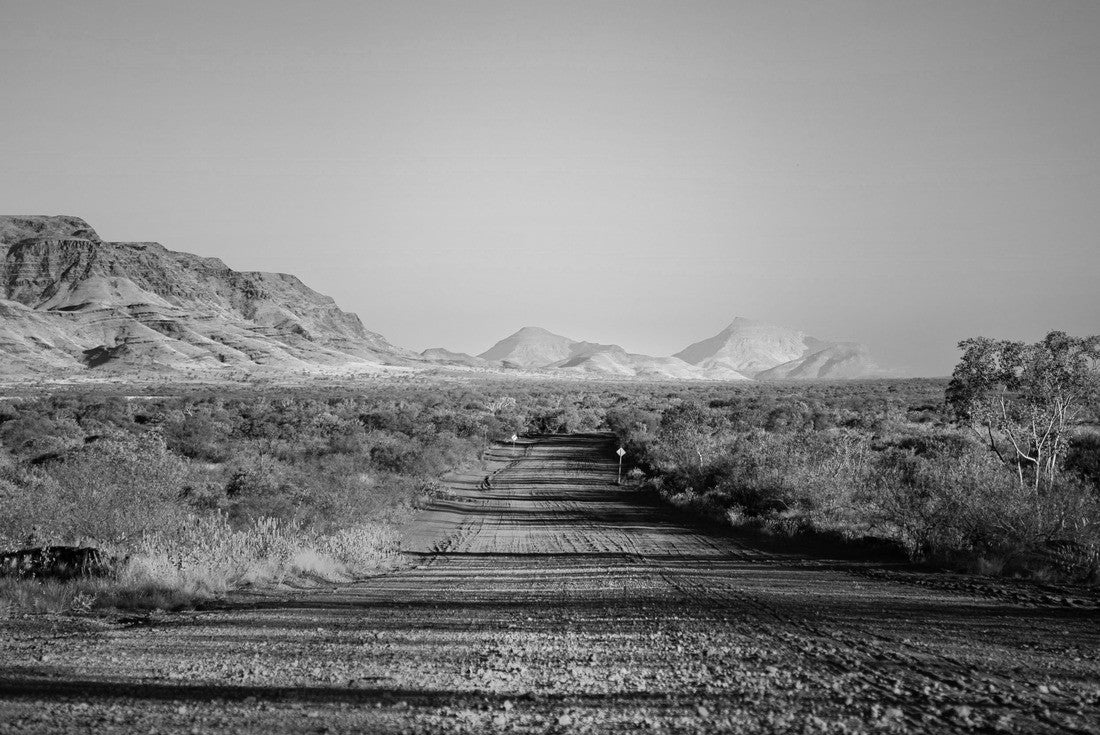 One of the most beautiful red dirt-roads in the Karijini National Park in Western Australia at sunset 2000pc PuzzleBlack and White