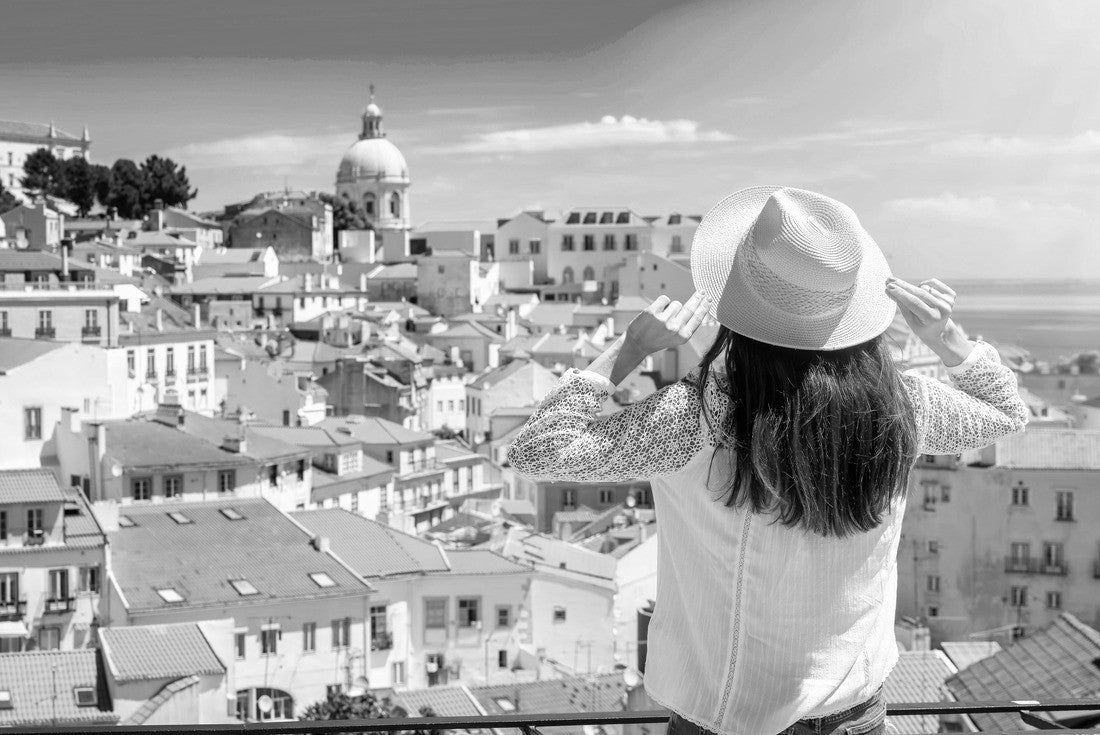 A tourist woman looks at the beautiful cityscape of Lisbon, with the colorful houses and roofs at the Alfama district, Portugal 2000pc PuzzleBlack and White