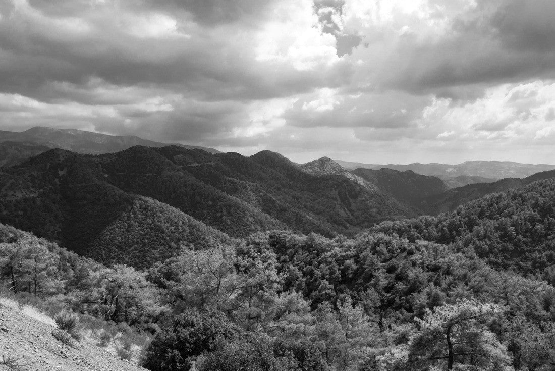top view from Kykkos monastery area of Troodos mountains range with green hills and pine forests in front of cloudy sky, Cyprus 2000pc PuzzleBlack and White