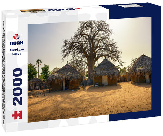 Noah Jigsaw Puzzle Traditional village houses with a baobab tree in the background in Senegal, Africa. The baobab tree is revered in Senegal, where it is the nation's symbol 2000 pieces