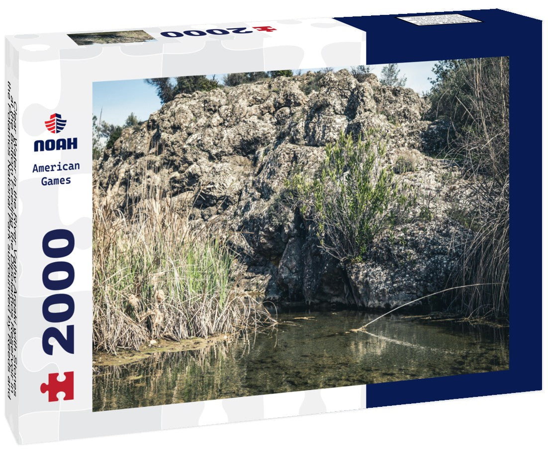 Clear Water in the River Vathy Argaki with Stones at the Bottom Feeding the Dipotamos Reservoir in the Potamos National Park surrounded by Reeds and Gray Rocks (Kornos, Larnaca District, Cyprus) 2000pc Puzzle