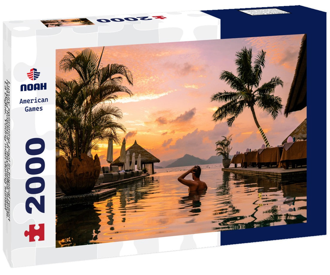 Luxury swimming pool in tropical resort, relaxing holidays in Seychelles islands. La Digue, Young man during sunset by swimpool Seychelles 2000pc Puzzle