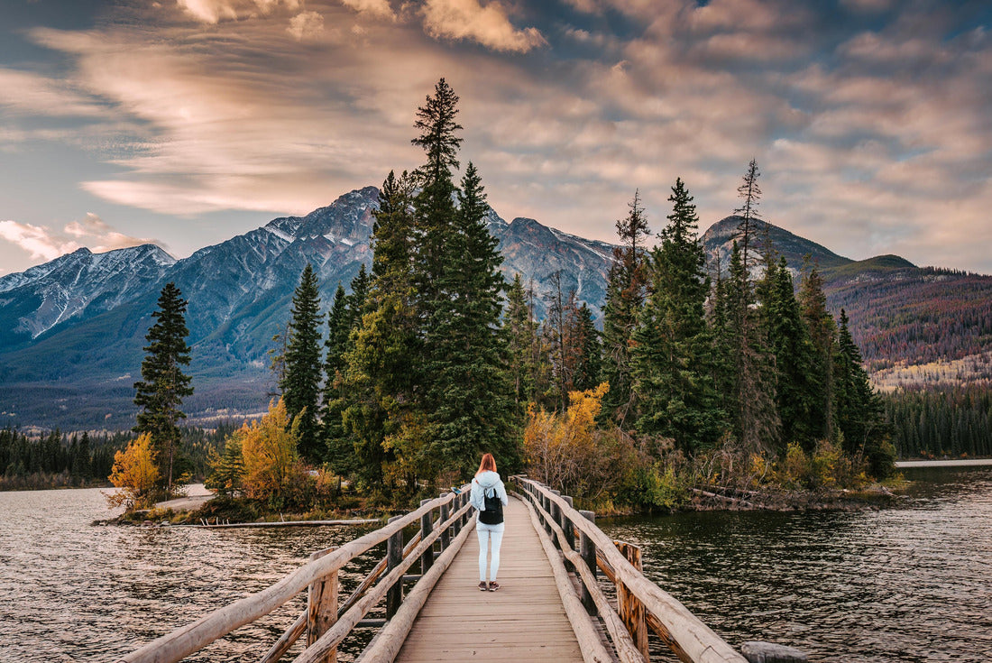 Female tourists standing on a wooden bridge on a small island at Pyramid Lake in the evening in Jasper National Park, AB, Canada 2000pc Puzzle
