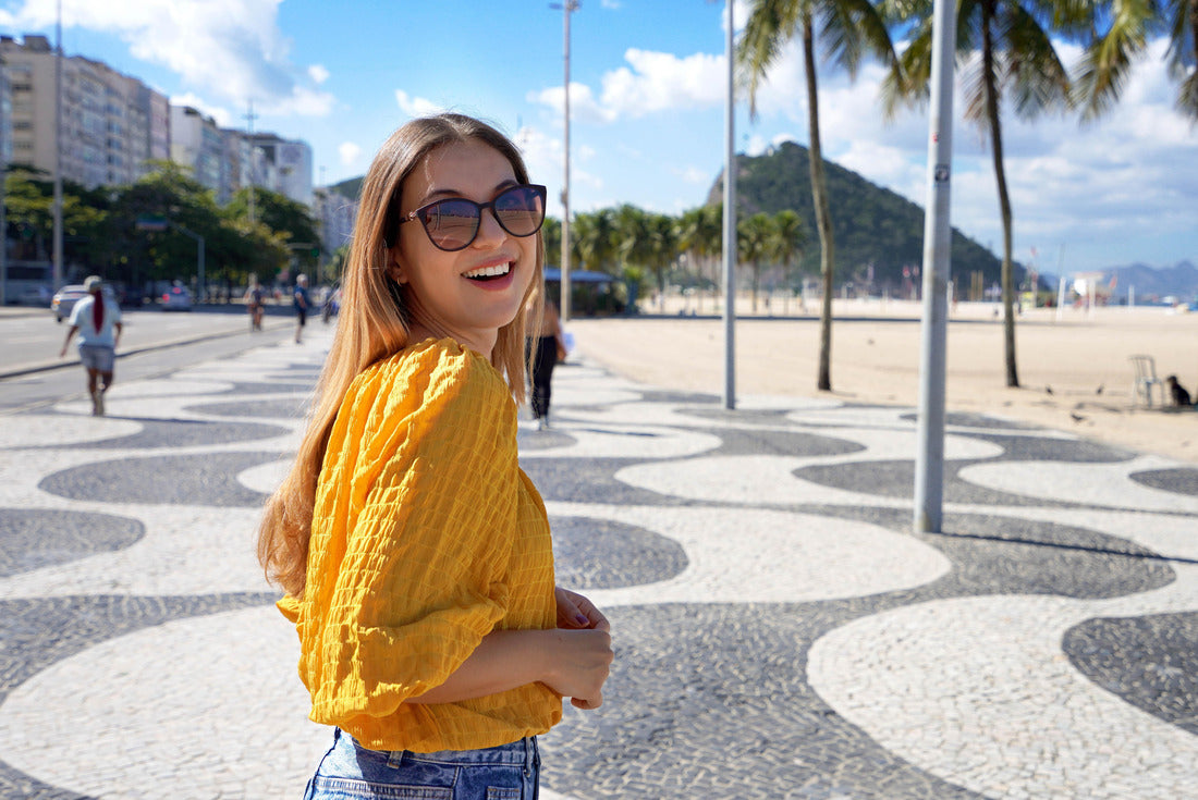 Portrait of an attractive smiling woman walking on the boardwalk of Copacabana and turning to the camera, Rio de Janeiro, Brazil 2000pc Puzzle