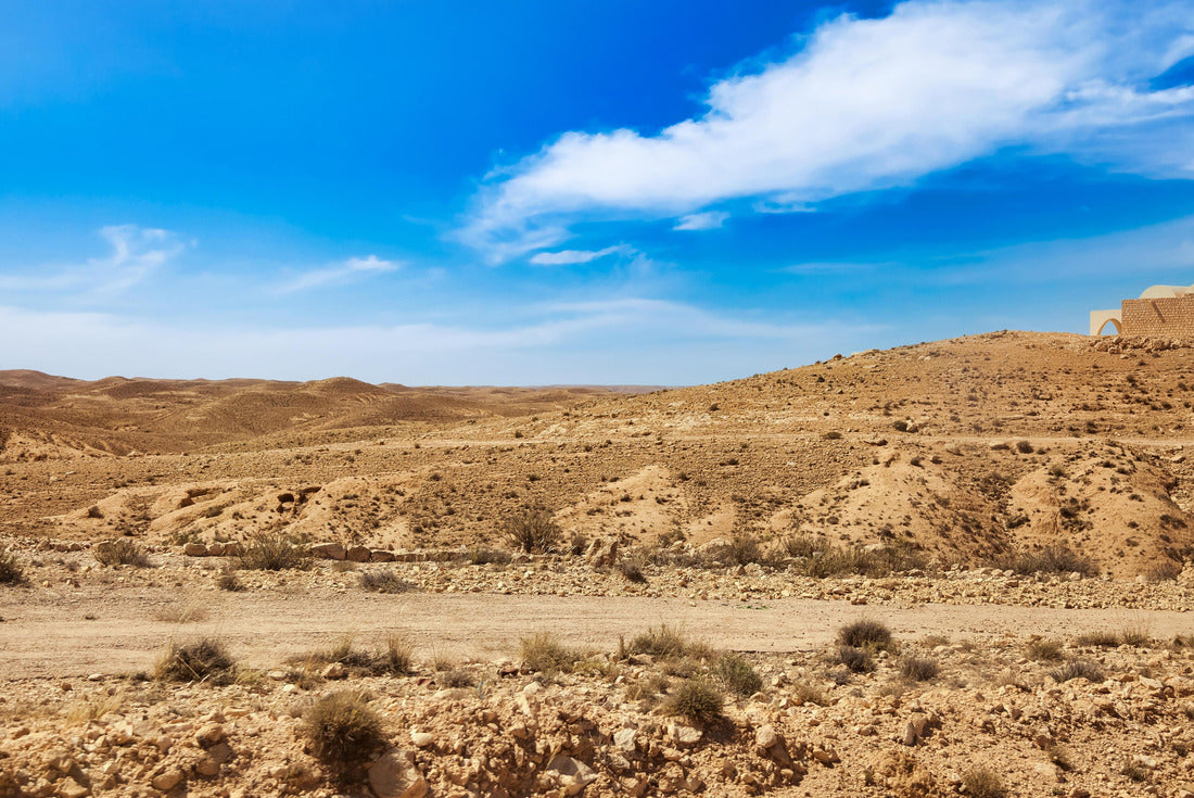 the desert hills of the Sahara with sand dunes and stones, vegetation and blue sky. Landscape photography of wide sandy desert sunny day, Sahara, Tozeur city, Tunisia 2000pc Puzzle