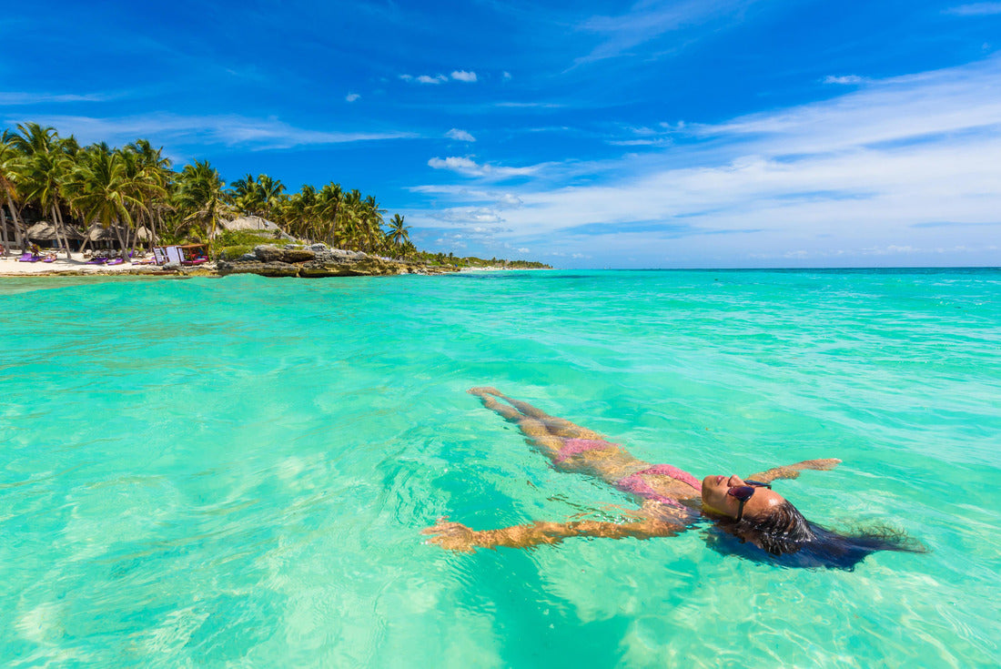 Attractive young woman relaxing in the turquoise waters of the Caribbean Sea in front of Paradise Beach in Tulum, near Cancun, Riviera Maya, Mexico 2000pc Puzzle