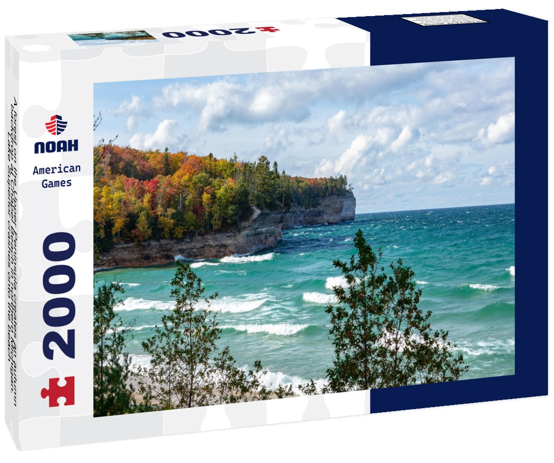 A forest on the Upper Peninsula creates an autumn backdrop at Chapel Beach in northern Michigan. Lake Superior crashes onto the beach, puffing clouds of white across the blue sky 2000pc Puzzle