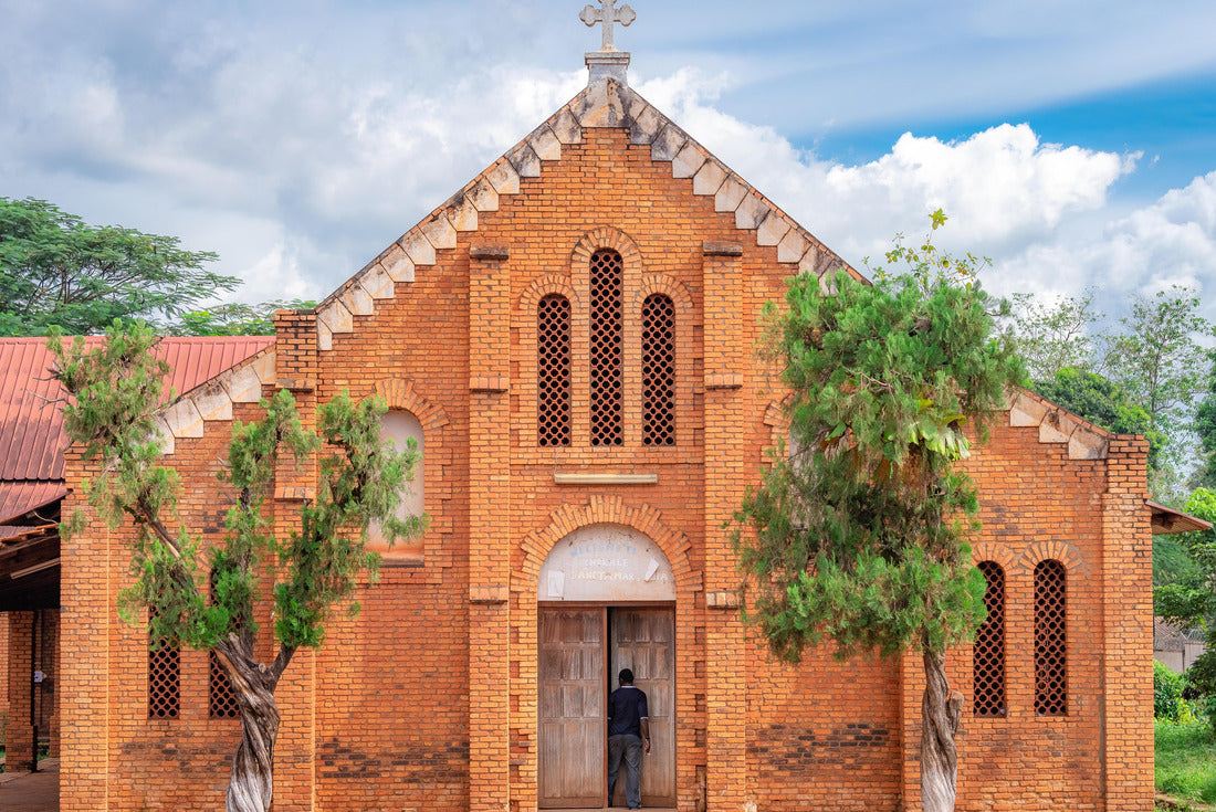 African man stepping into the doorway of a small church at the Cathedral Bangui, Notre Dame, famous church in the Central African Republic 2000pc Puzzle