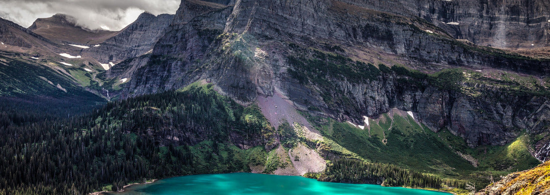 This is a view of one of the 3 Grinnell lakes and surrounding mountains, taken from the Grinnell Glacier Trail in the Many Glacier area of Glacier National Park in Montana 1000pc Panoramic Puzzle
