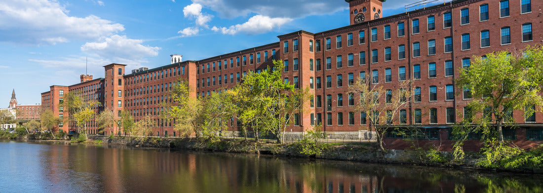 Noah Jigsaw Puzzle Historical building of a cotton factory with a clock tower in an old industrial park on Nashua River in May. Nashua, New Hampshire panorama 1000 pieces