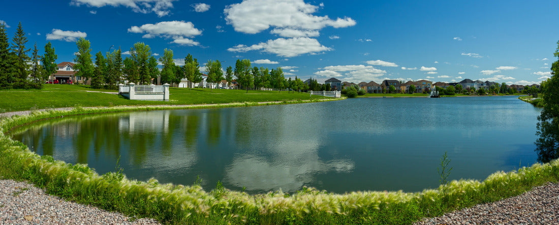 Beautiful pond with estate homes in the background in Winnipeg. Canada 2000pc Panoramic Puzzle