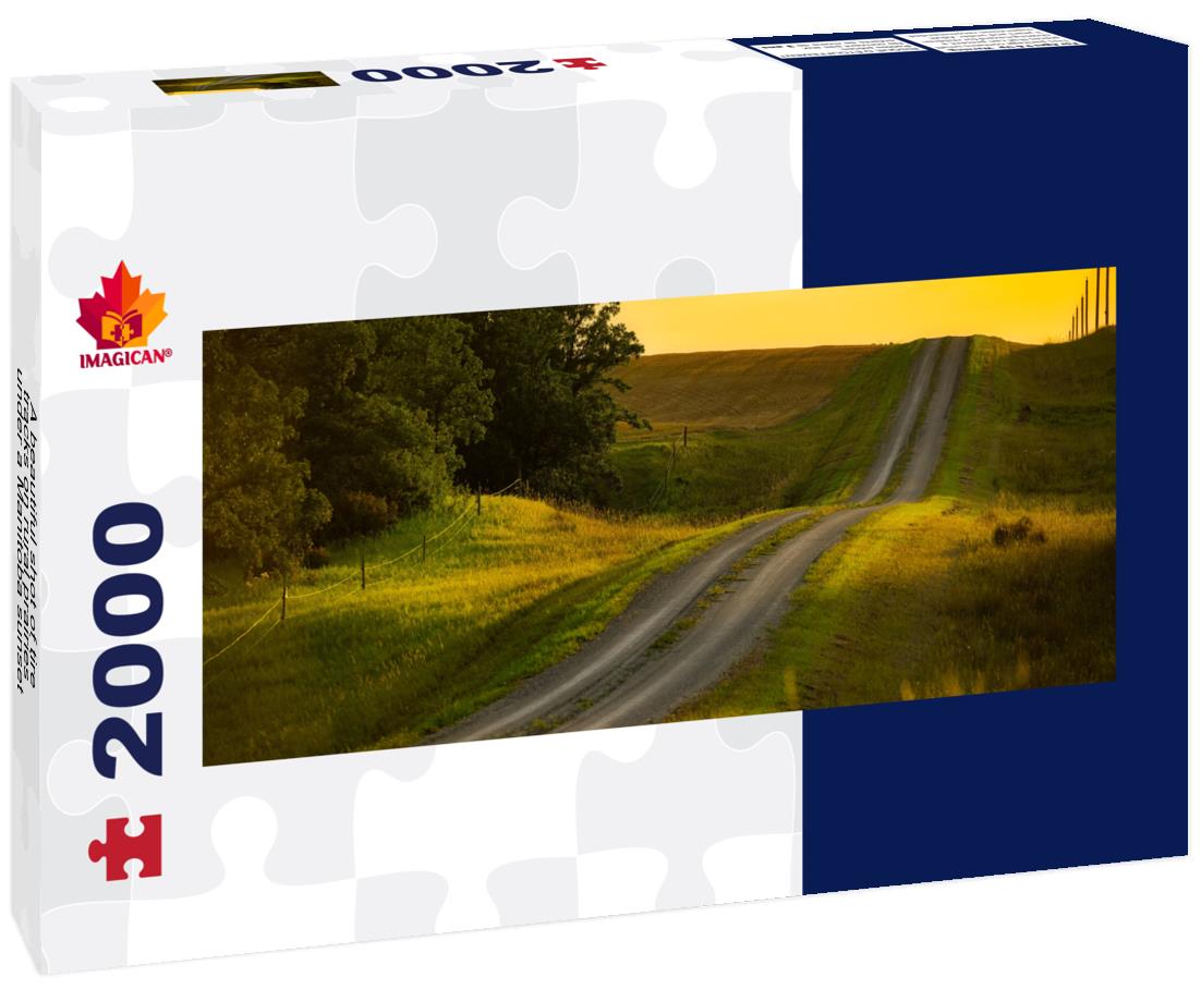 A beautiful shot of tire tracks on rural prairies under a sunset in Manitoba 2000pc Panoramic Puzzle