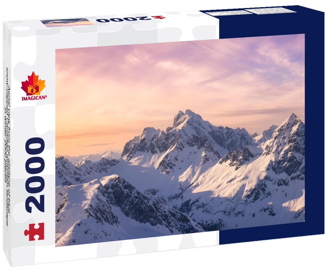 Aerial view from the airplane of blue snow-capped Canadian mountain landscape in winter 2000pc Puzzle