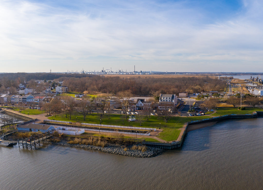 Aerial view of Delaware City New Castle County, Delaware, United States. Small port town on the eastern terminus of the Chesapeake and Delaware Canal with an oil refinery in the background