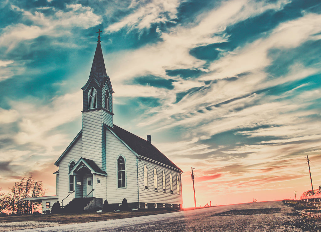 Ellis County, Kansas, USA - A Lone Wooden Christian Church at Dusk Sunset Skies in the Western Kansas Prairie