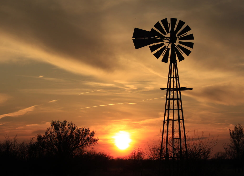 Kansas Windmill Silhouette at Sunset with clouds