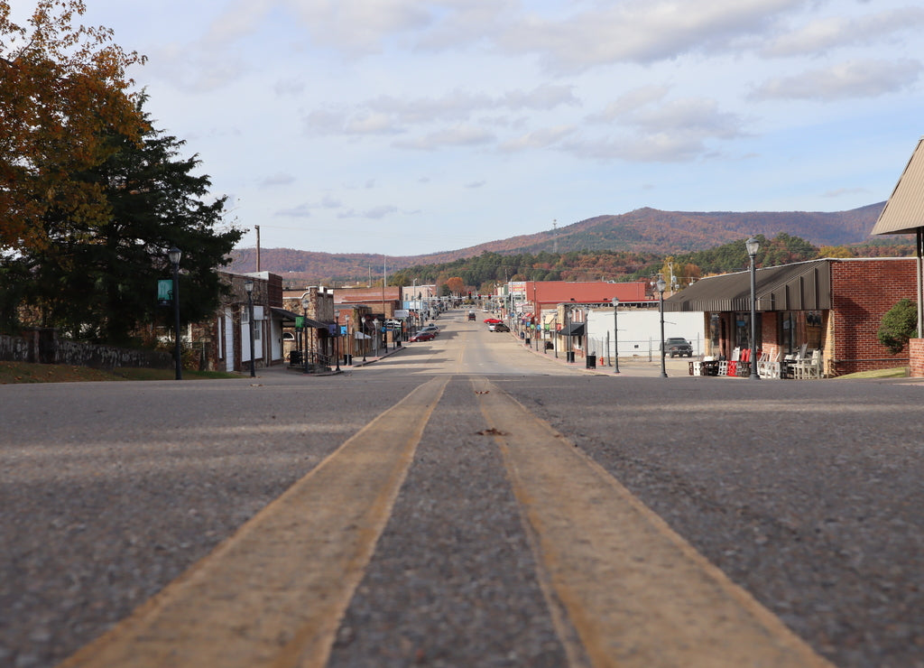 A street-level perspective view down a small town main street, Mena Street, Mena, Arkansas