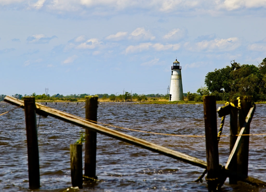 Madisonville Light House along the shore of Lake Pontchartrain in Madisonville, Louisiana on a sunny spring day