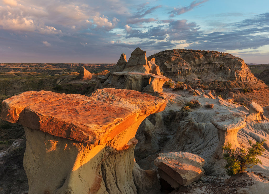 Sculpted badlands formations at first light in Theodore Roosevelt National Park, North Dakota, USA