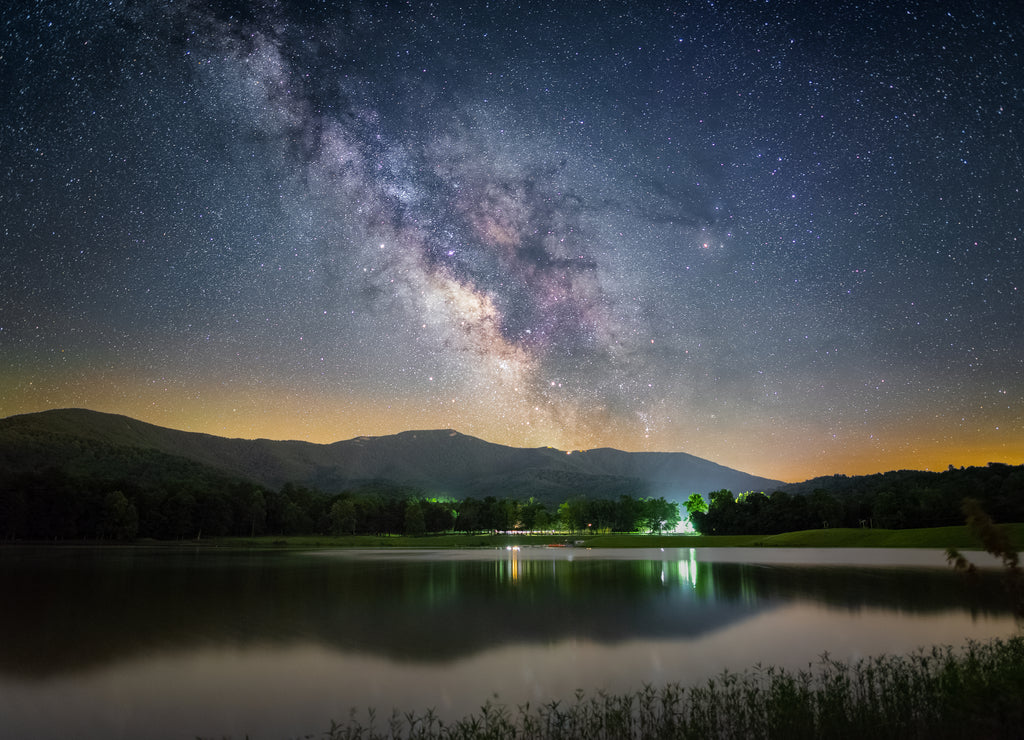 The Milky Way shining over Shenandoah National Park viewed from Lake Arrowhead in Luray, Virginia