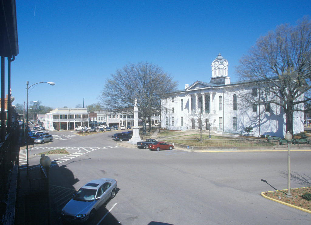 Lafayette County Court House in center of historic old southern town and storefronts of Oxford, Mississippi