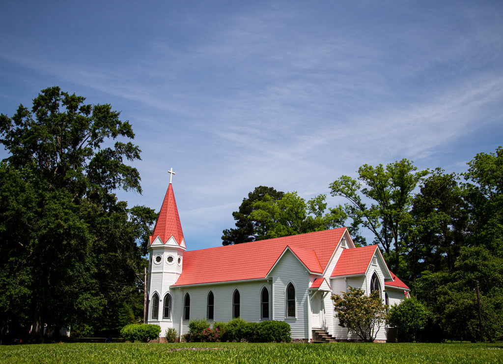Rural white church with a red roof in Jackson, Mississippi, United States