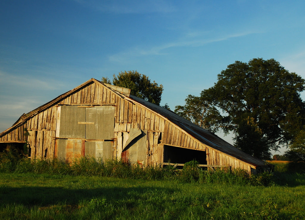 A dilapidated barn is barely standing in rural Mississippi