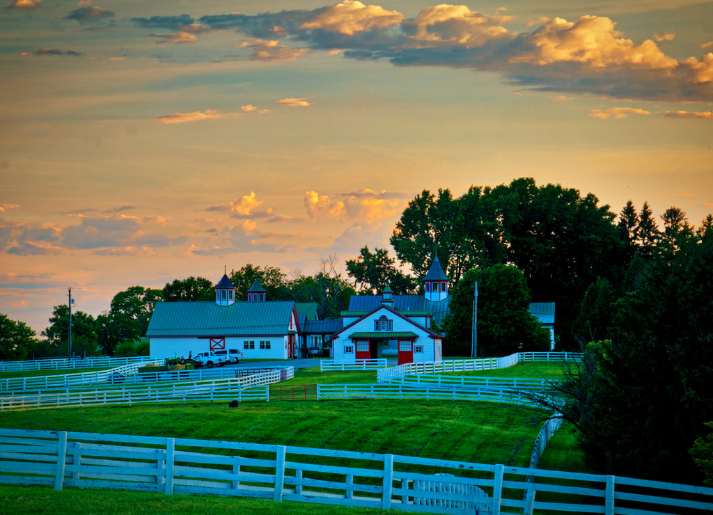 Dramatic clouds during sunrise over horse farm near Lexington, Kentucky