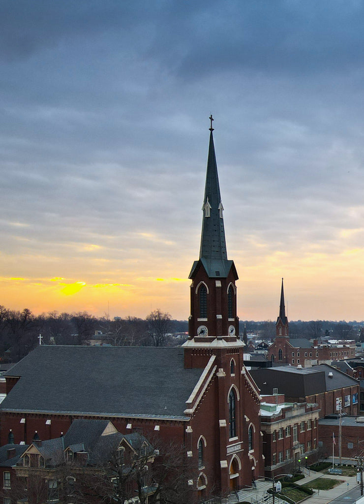 Aerial view of Lexington, Kentucky skyline during sunrise. Tall office buildings visible on the right side of the image