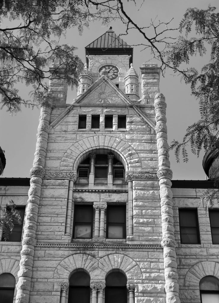 Clock tower in the Wichita-Sedgewick County Historical Museum is in old city hall in downtown, Wichita, Kansas in black white