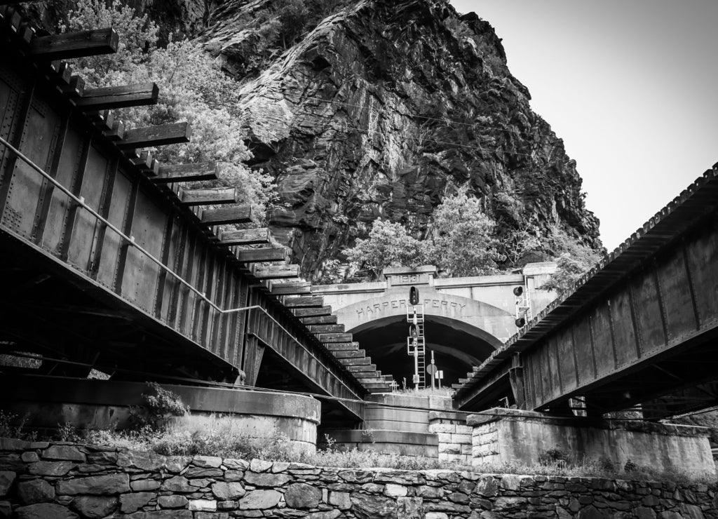 Train bridges and tunnel in Harper's Ferry, West Virginia in black white