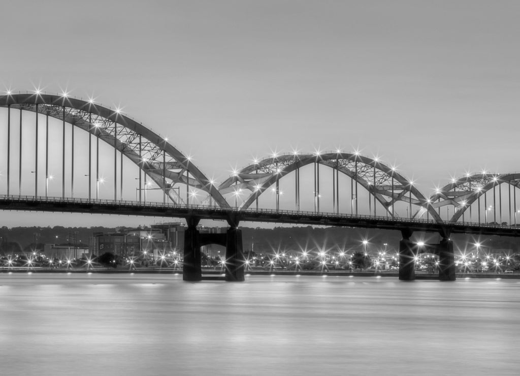 Centennial Bridge across the Mississippi River at dusk between Rock Island, Illinois and Davenport, Iowa USA in black white