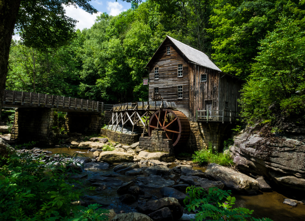 This is the Glade Creek Gristmill, located in Babcock State Park in West Virginia.. It sits next to the creek in a very wooded area