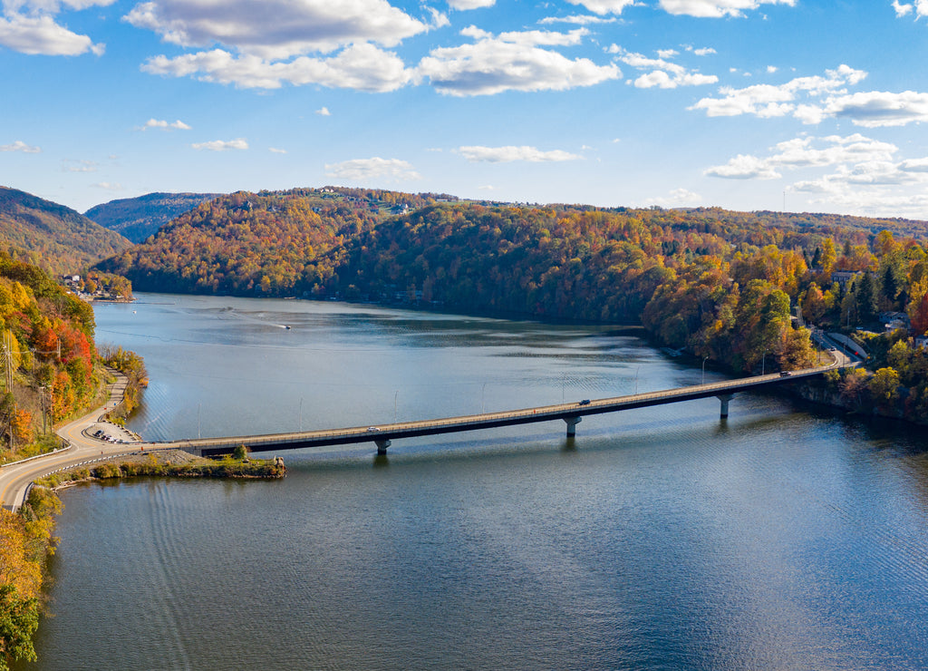 Aerial drone panorama of the autumn fall colors surrounding Cheat Lake and the Old Cheat Road bridge near Morgantown, West Virginia