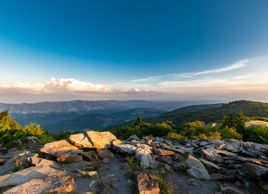 A dramatic sunset viewed from Spruce Knob West Virginia in the Appalachian Mountains looking down on hills in the surrounding valleys