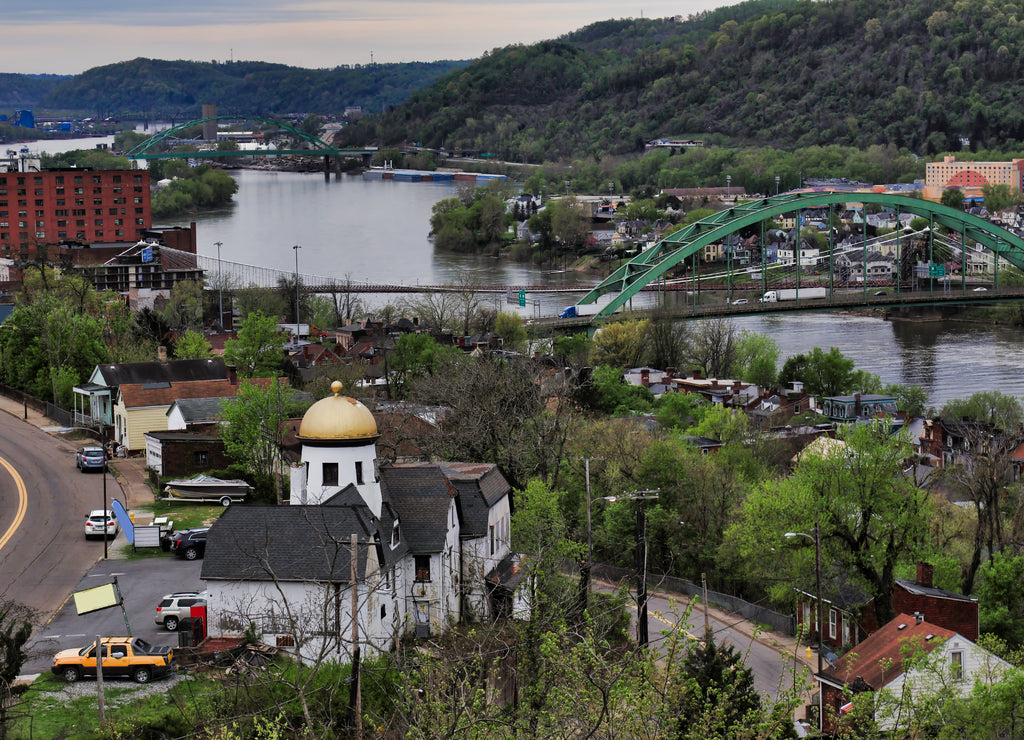 This is an aerial view of Wheeling, West Virginia along the Ohio River. This skyline cityscape shows Wheeling Island in the distance