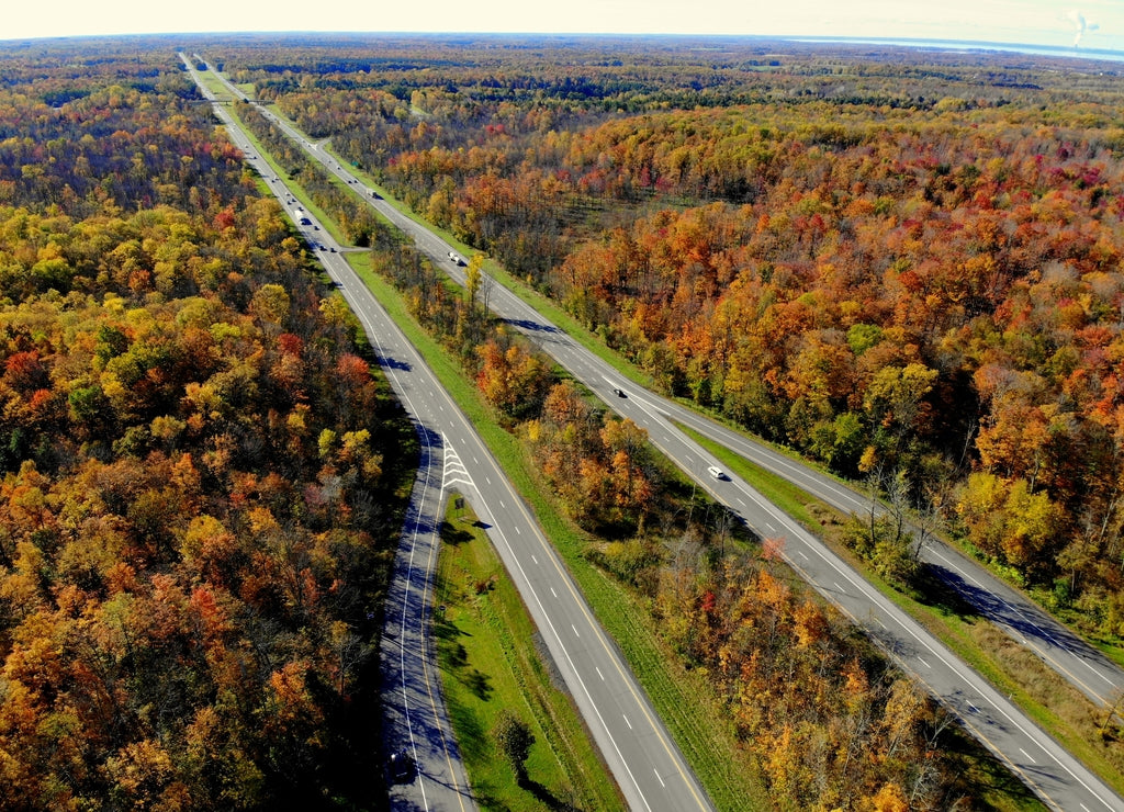 The aerial view of stunning fall foliage near Interstate 81 highway of Watertown, New York, U.S.A