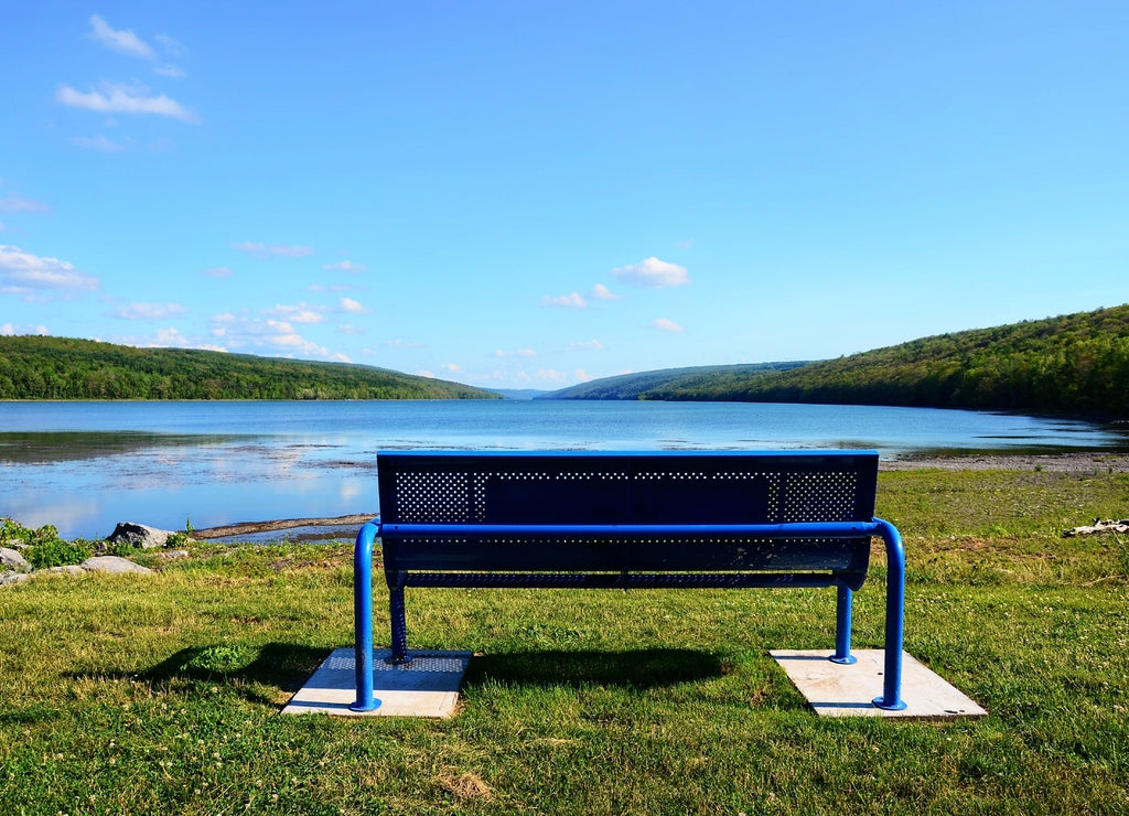 Bench on the lake. Overlooking Hemlock Lake, one of the minor Finger Lakes, located in Livingston County, New York, south of Rochester. It’s forever-wild, tranquil landscape