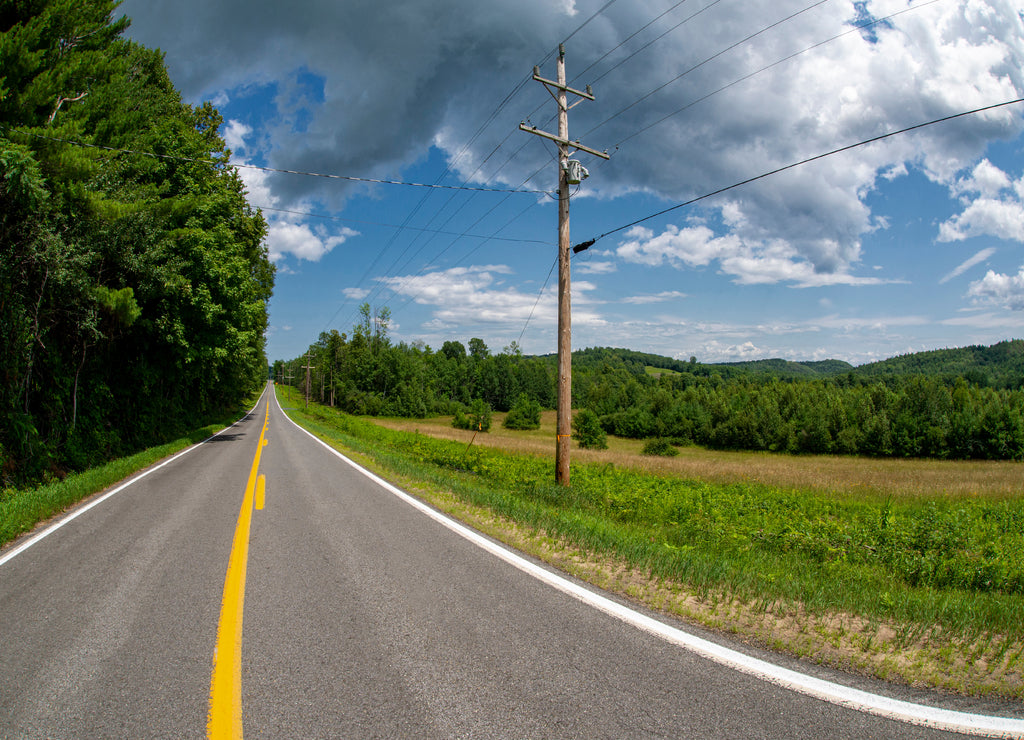 View of a road in perspective in summer in Clinton County New York